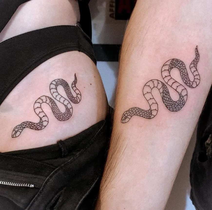 Snake tattoo on the groin and forearm 