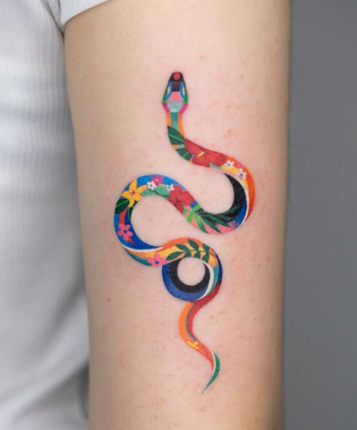 Multicolor snake tattoo on arm 