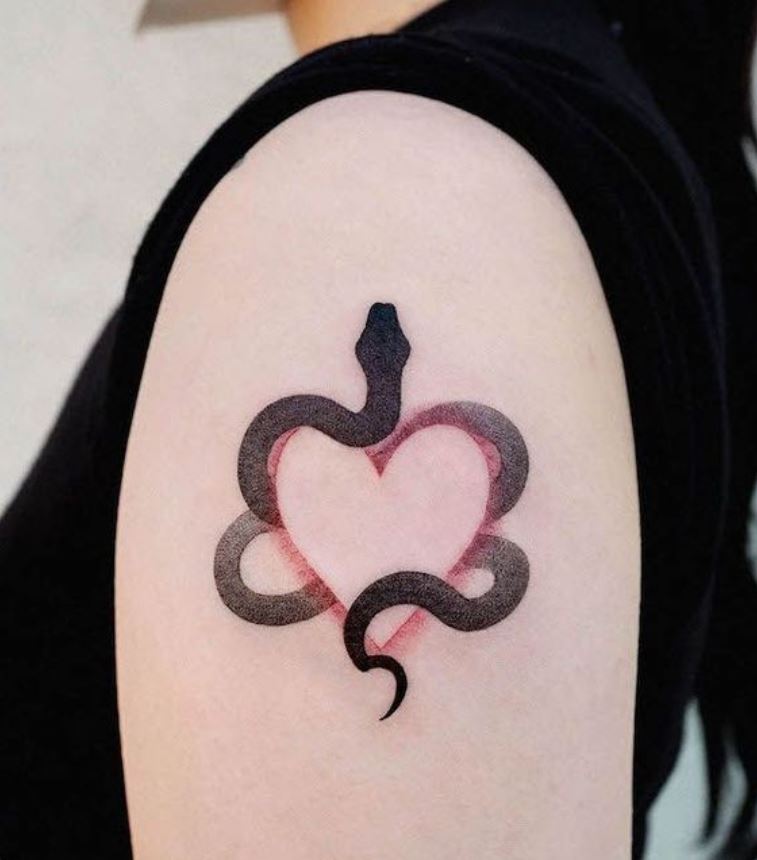 Snake and heart tattoo on hand 