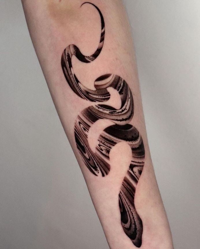 Marble snake tattoo on forearm