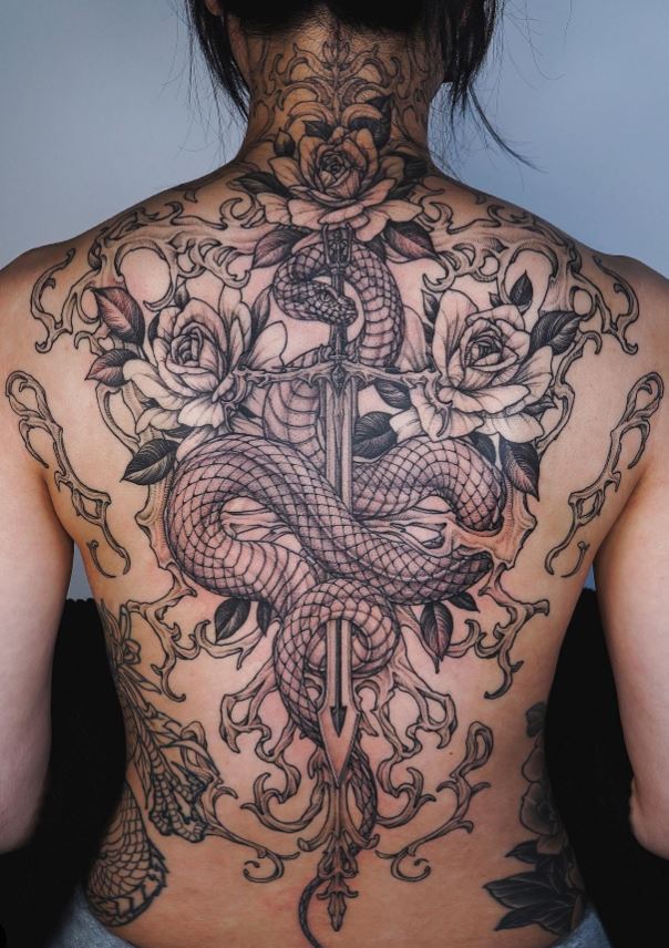 Snake tattoo on dagger and roses 