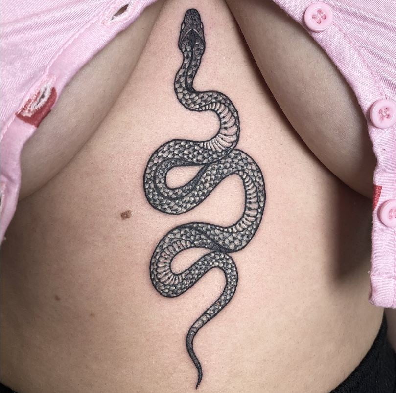 Snake tattoo on chest and abdomen 