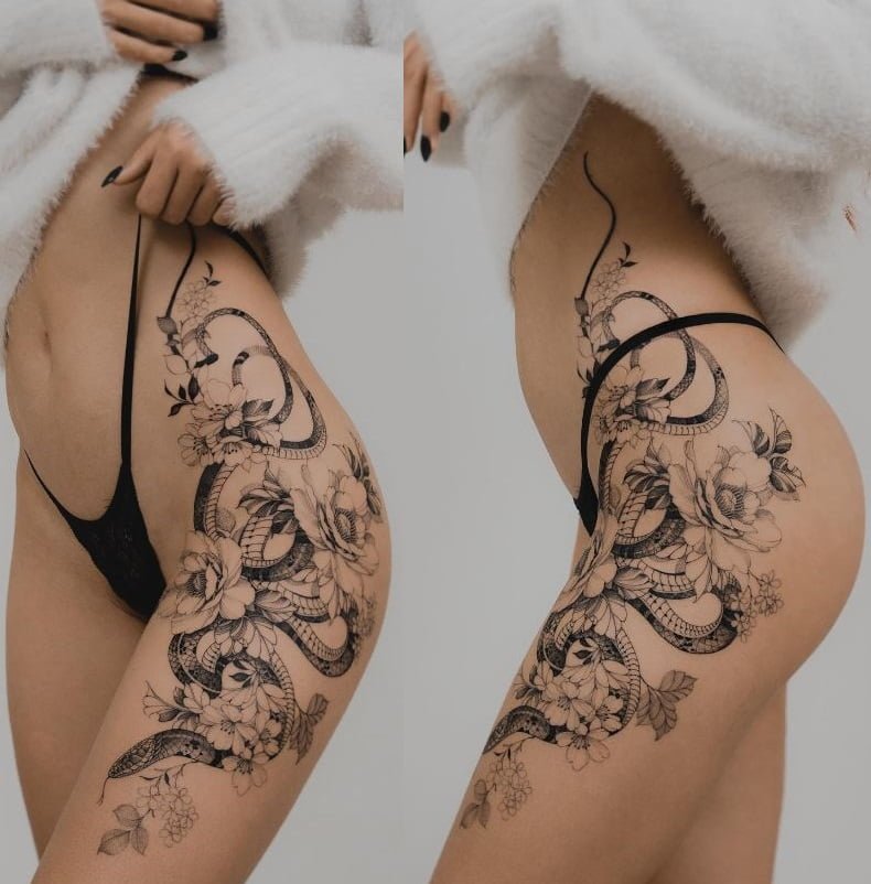 Snake and flowers tattoo on hip and thigh 