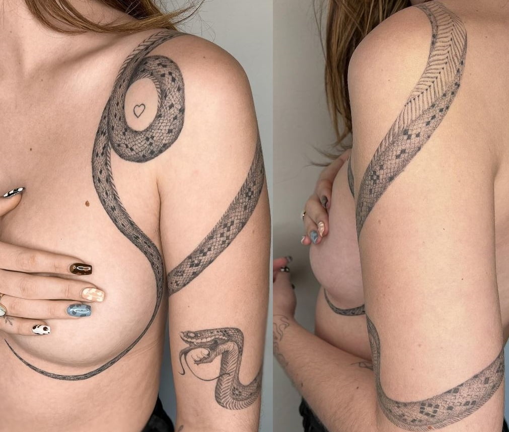 Snake tattoo on chest and arm 