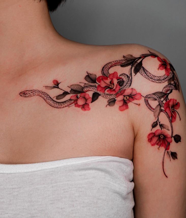 Snake and camellia tattoo on your collarbone and shoulder 