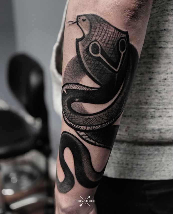 Cobra snake tattoo on forearm 