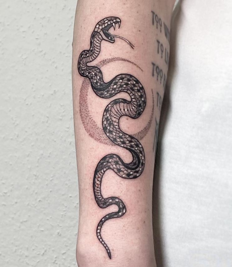Snake and crescent moon tattoo 