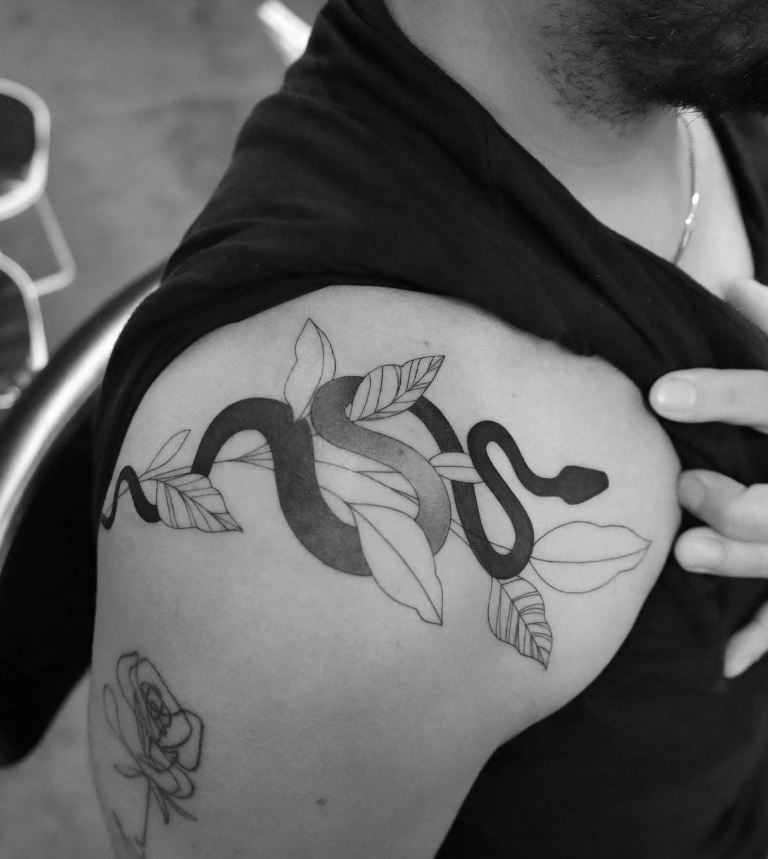 Snake and leaf tattoo on shoulder 