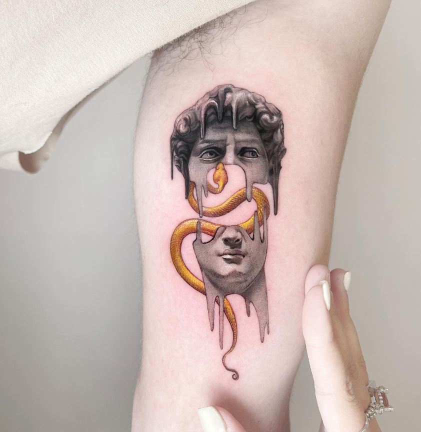 Snake and David statue tattoo
