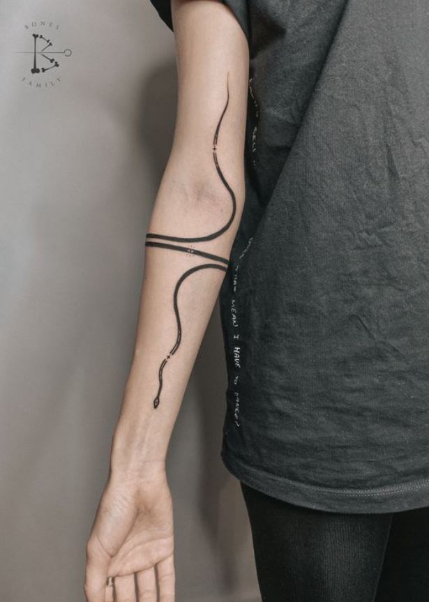 Mini long snake tattoo. 
