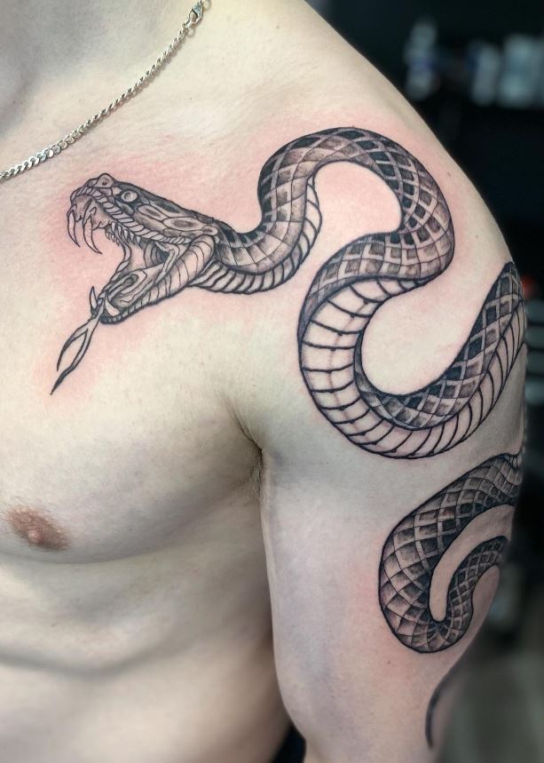 Snake tattoo on shoulder and arm 