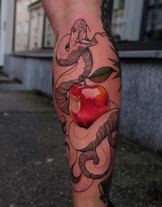     Snake and apple tattoo on his leg