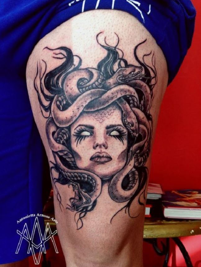 Medusa snake tattoo on the thigh 