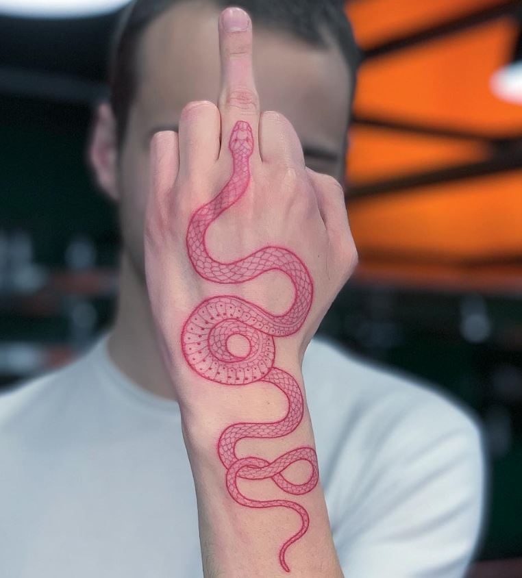 Red snake tattoo on hand and wrist 
