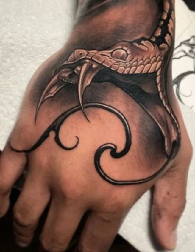 Snake head tattoo on your arm 